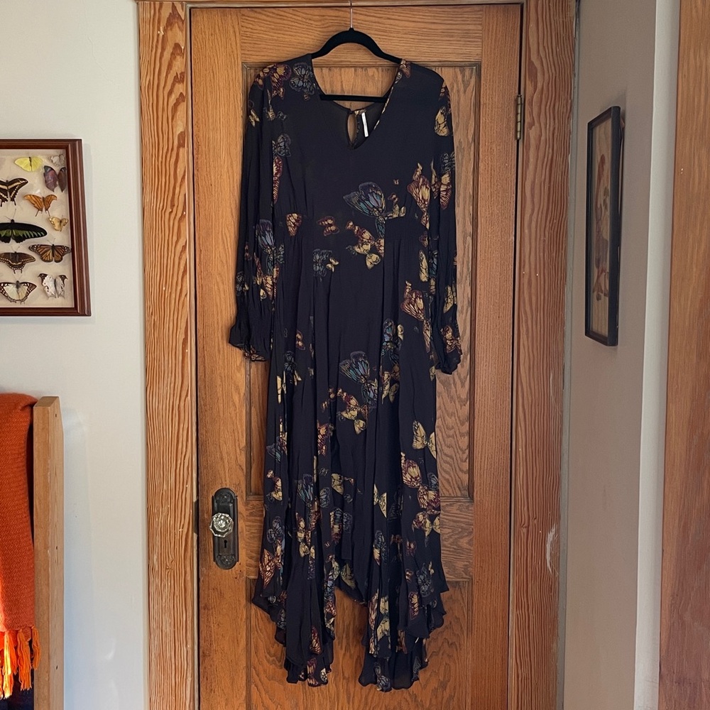 Free People Butterfly Babe Maxi Dress in a dark floral print.